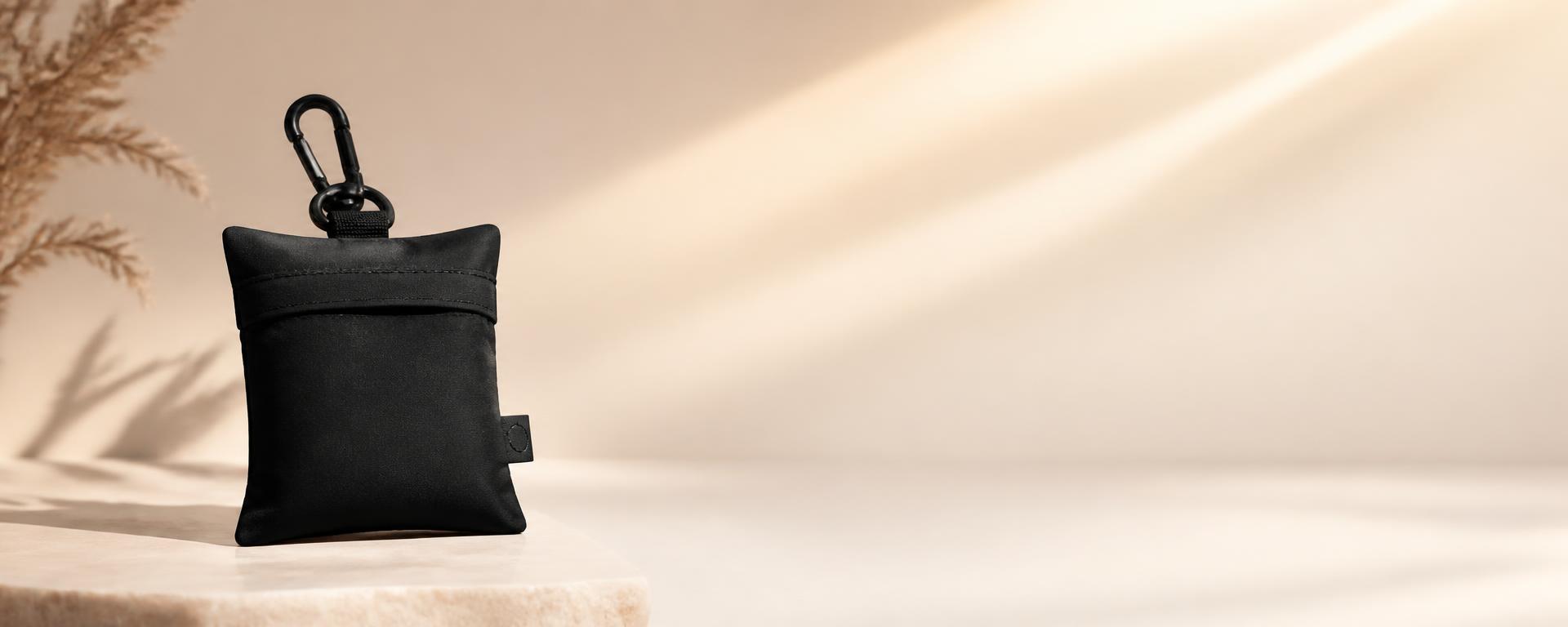 PLIA Pocket Tote on a warm neutral studio backdrop