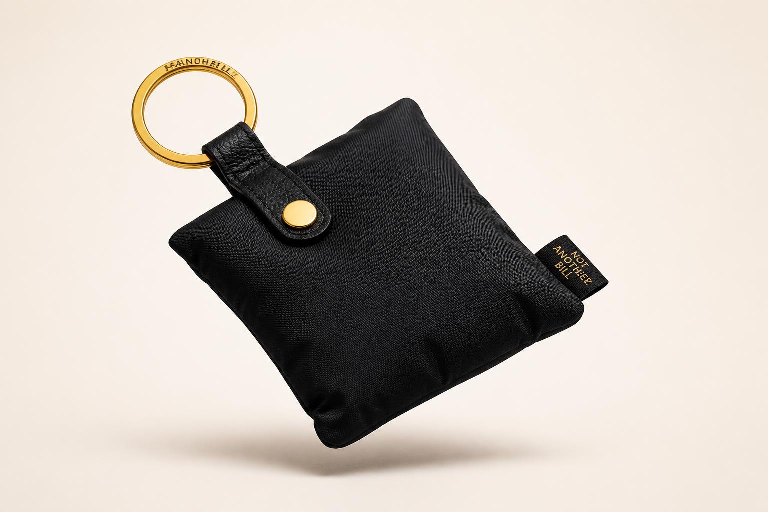 PLIA Pocket Tote folded into a compact keychain pouch